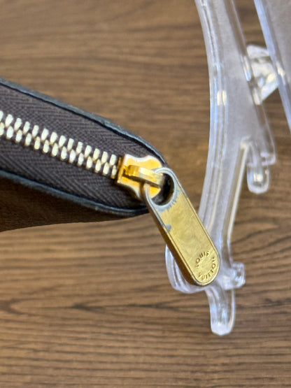 LOUIS VUITTION ZIPPED AROUND CARD WALLET IN REVERSE MONOGRAM