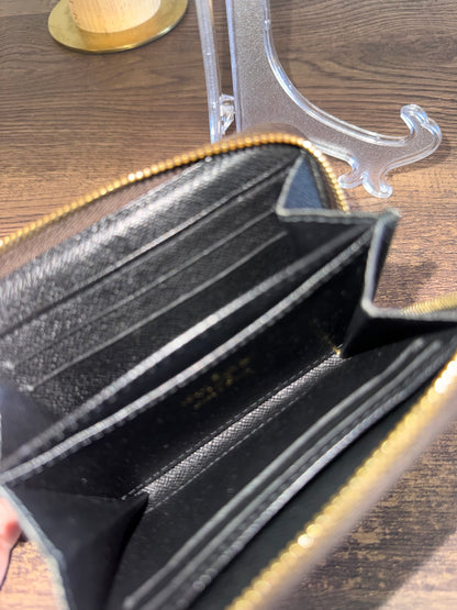 LOUIS VUITTION ZIPPED AROUND CARD WALLET IN REVERSE MONOGRAM