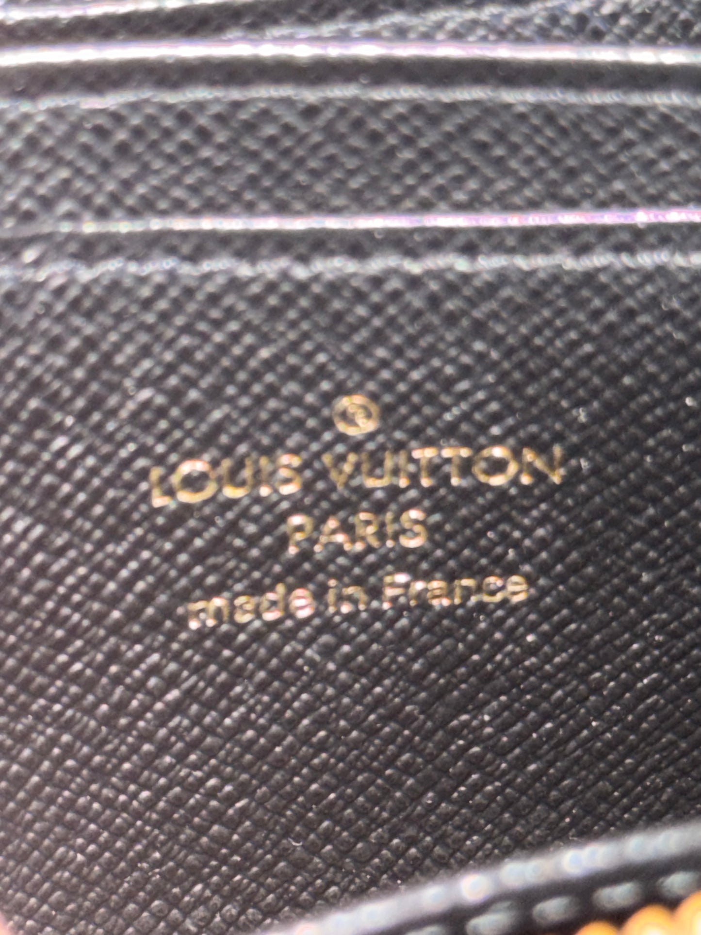 LOUIS VUITTION ZIPPED AROUND CARD WALLET IN REVERSE MONOGRAM