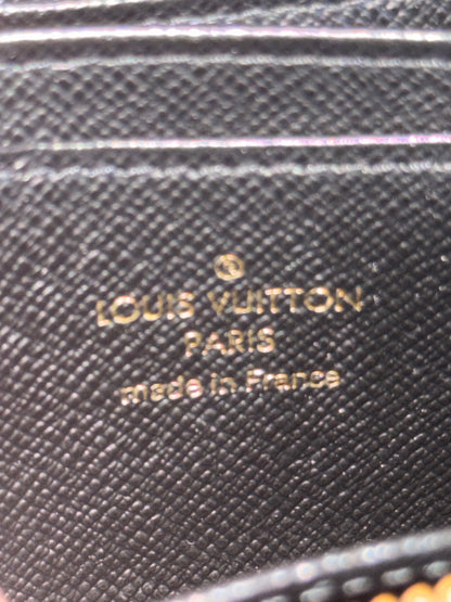 LOUIS VUITTION ZIPPED AROUND CARD WALLET IN REVERSE MONOGRAM