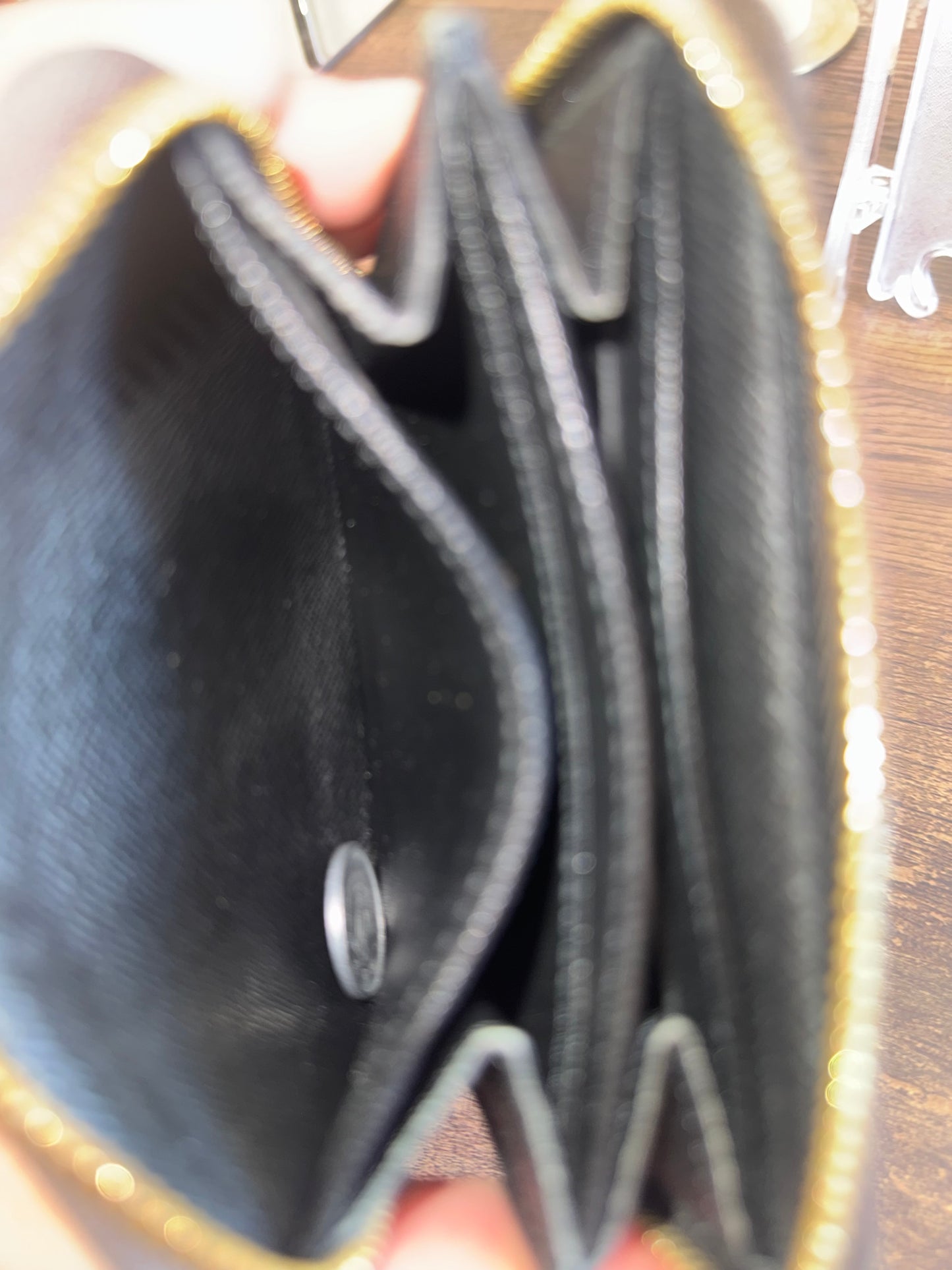 LOUIS VUITTION ZIPPED AROUND CARD WALLET IN REVERSE MONOGRAM