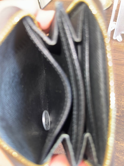 LOUIS VUITTION ZIPPED AROUND CARD WALLET IN REVERSE MONOGRAM