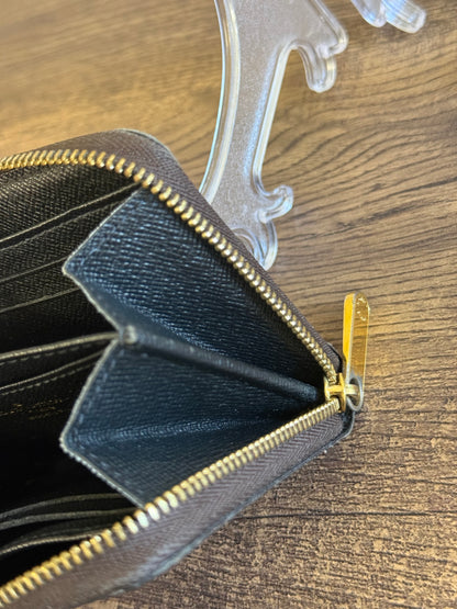 LOUIS VUITTION ZIPPED AROUND CARD WALLET IN REVERSE MONOGRAM