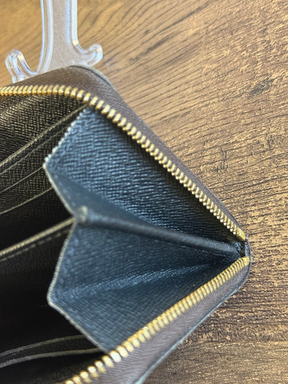 LOUIS VUITTION ZIPPED AROUND CARD WALLET IN REVERSE MONOGRAM